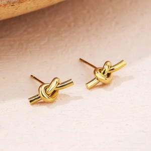 Minimalist polished gold knot stud earrings with a sleek twisted design for women