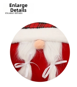 Detail of Christmas gnome plush featuring red plaid hat and white braided pigtails