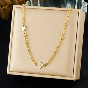 Exquisite gold stainless steel necklace featuring diamond-set flower charms on textured chain