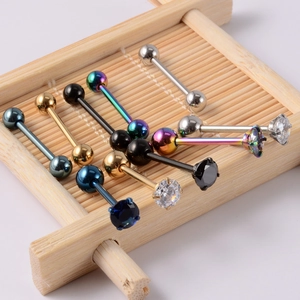 Stainless steel 14G tongue rings set with colorful CZ stones on bamboo display stand