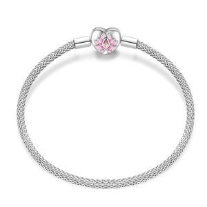 Detail of silver woven mesh bracelet featuring a heart bead with pink lotus enamel