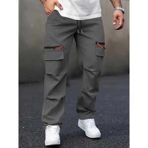 Men's dark grey cargo pants with elastic waist and vibrant orange zipper pockets