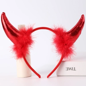 Close-up of red sequined devil horn headband with soft feather trim for Halloween