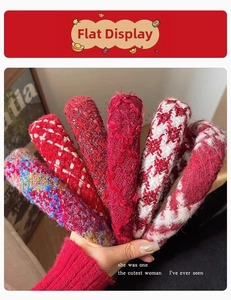 Detail of assorted red tweed headbands with woven textures in classic French style