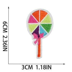 Detailed view of rainbow lollipop embroidery patch with size labels 6cm by 3cm