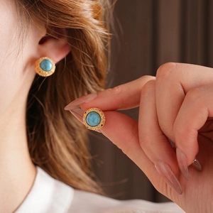 Vintage 18k gold plated turquoise stud earrings with ornate hollow floral design