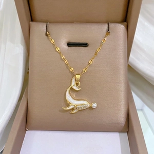 Elegant gold dolphin necklace with sparkling zircon crystals and a white pearl accent