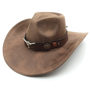 Detail of western cowboy hat featuring leather band with silver longhorn bull head emblem