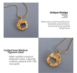 Detailed view of 18K gold plated titanium steel irregular hollow pendant with snake chain