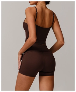 Rear view of tight dark brown yoga set featuring camisole top and high waist shorts
