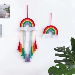 Detailed handmade cotton rainbow macrame wall hanging with colorful fringes for home decor