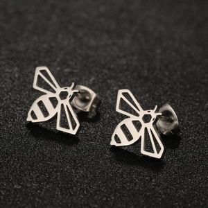 Macro shot of geometric hollow bee stud earrings in polished silver stainless steel