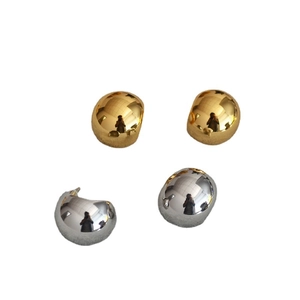 Polished metallic spherical stud earrings in gold and silver finish with a minimalist look