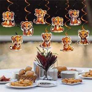 Tiger theme birthday party decorations with orange spirals and cartoon tiger pendants