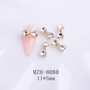Detail view of MZH-8080 crystal bowknot nail charms with 11x5mm gold metal base