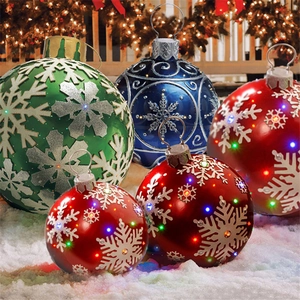Inflatable PVC Christmas ball decorations with LED lights and snowflake patterns on snow