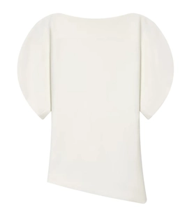 Close-up of white asymmetric top featuring curved puff sleeves and diagonal hemline