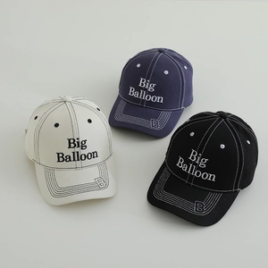Three kids' embroidered baseball caps in beige, navy, and black with Big Balloon logo