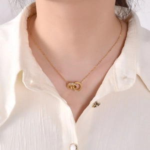 Minimalist double ring necklace in gold finish with sparkling cubic zirconia inlay