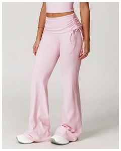 Detail of high waist yoga flare pants featuring side drawstring ruched texture in pink