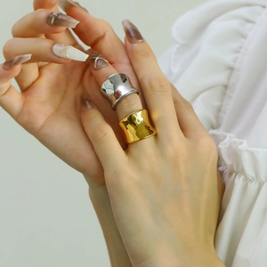 French style gold and silver stainless steel rings with geometric inner arc on a model