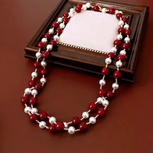Vintage long red and white beaded necklace with golden metal spacers for layering