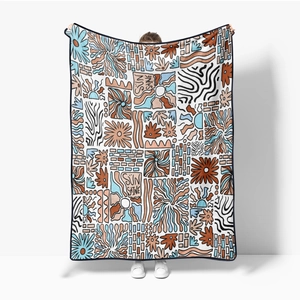 Detailed texture of bohemian pop art flannel blanket with sun and floral mosaic patterns
