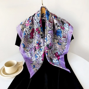 Detail of 90cm square silk scarf featuring a colorful cartoon cat pattern in purple and pink