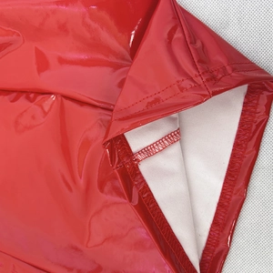 Detailed stitching and white knit lining on bright red glossy PU leather dress