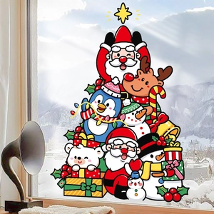 Christmas tree window stickers with Santa Claus and reindeer on a winter glass background