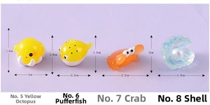 Miniature marine animal charms including octopus, pufferfish, crab, and shell with pearl