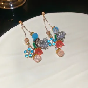 Colorful crystal flower teardrop tassel earrings with blue blossoms and gold metal chains