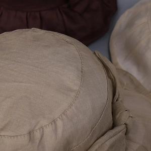 Close-up of lightweight ramie sun hat showing natural woven texture and bow detail