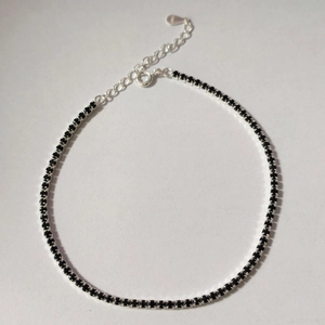 Close-up of S925 sterling silver tennis bracelet with black cubic zirconia and clasp