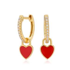 Detail of gold earrings with pavé zircons and red enamel heart lock pendants