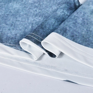 Close-up of precise stitching and knit texture on the blue floral bodycon skirt fabric