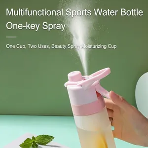 Pink and white mist spray water bottle showing misting function for outdoor sports