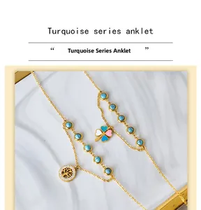 Detail of gold double-layer anklet featuring turquoise beads and tree of life charm