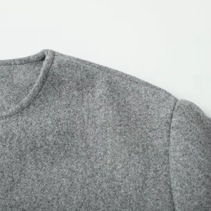 Detail of the crew neck and shoulder seams on this gray wool texture zip-up jacket