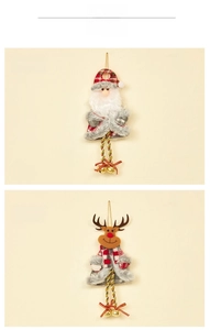 Detail of Santa and Reindeer fabric ornaments with gold bells and plaid patterns