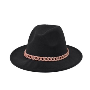 Detail of a black wool felt fedora featuring a decorative thick pink chain link hatband