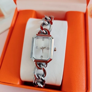Elegant silver square watch with diamond markers in a premium orange gift box