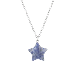 Macro detail of natural blue stone star pendant with silver chain necklace on white background