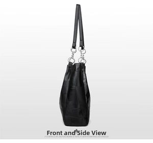 Detail view showing side stitching and silver hardware of the black PU leather tote bag
