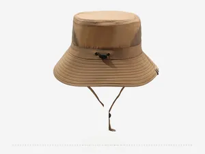 Macro shot of khaki outdoor sun hat featuring breathable mesh crown and adjustable drawstring