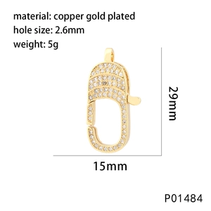 Macro detail of gold plated heart lobster clasp with white cubic zirconia pavé