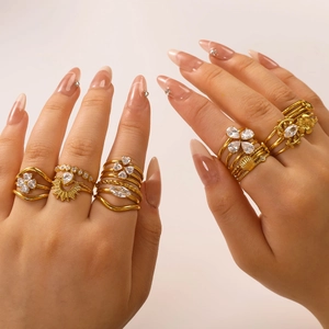 Stackable gold zircon heart and floral rings set for women on model fingers