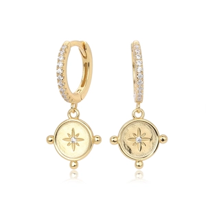 Macro view of gold S925 sterling silver hoop earrings with star pattern coin pendant