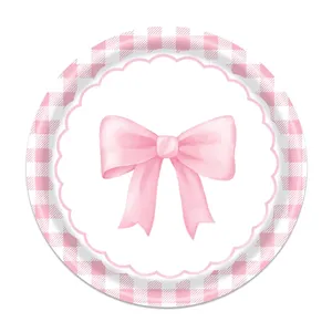 Detailed view of pink watercolor bow and checkered pattern on party paper plate