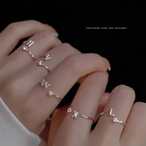 Adjustable sterling silver letter ring with sparkling crystal star for women
